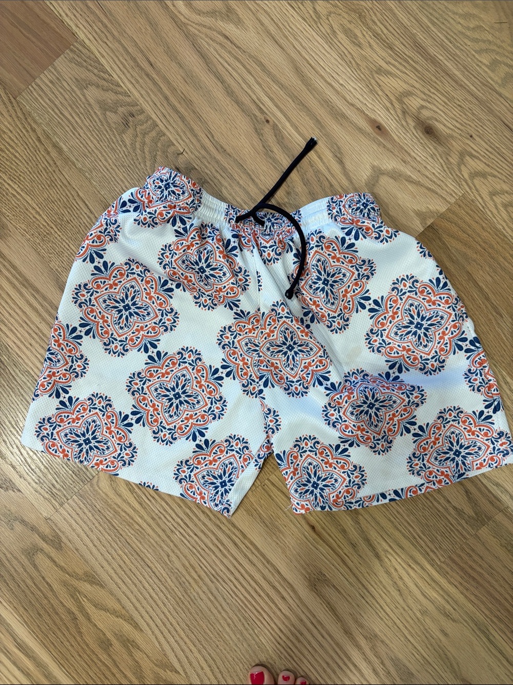 The Drip Shop Paisley patterned mesh shorts.